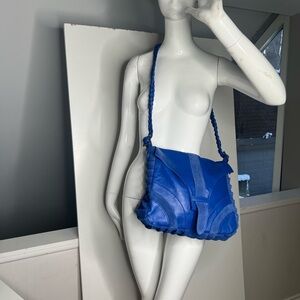 Ember Skye leather and suede crossbody bag in blue with a braided strap